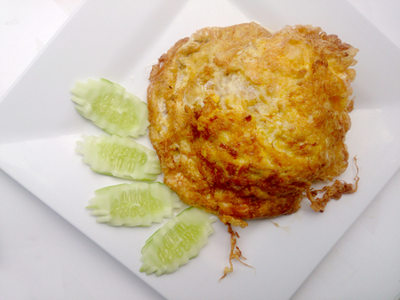 omelette on the white dish, It's popular traditional Thai style food.の写真素材