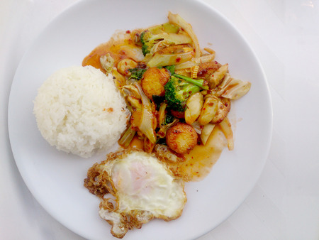 Fried tofu with mixed vegetables in white dish isolate on white background. Vegetarian Food, Healthy food.の写真素材