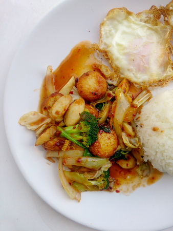Fried tofu with mixed vegetables in white dish isolate on white background. Vegetarian Food, Healthy food.の写真素材