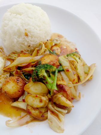 Fried tofu with mixed vegetables in white dish isolate on white background. Vegetarian Food, Healthy food.の写真素材