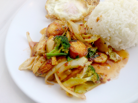 Fried tofu with mixed vegetables in white dish isolate on white background. Vegetarian Food, Healthy food.の写真素材