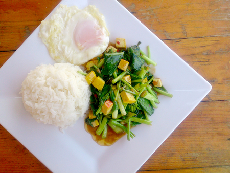 Stir Fried Chinese Kale with Tofu in white plate.. Vegetarian Food, healthy food.の写真素材