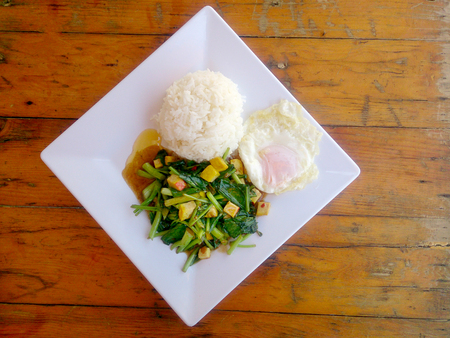Stir Fried Chinese Kale with Tofu in white plate.. Vegetarian Food, healthy food.の写真素材