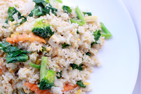 fried rice with vegetable on the white plate with withe background. Vegetarian Food, healthy food, Thai cuisineの写真素材