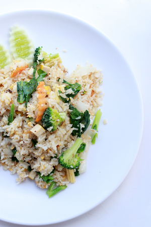 fried rice with vegetable on the white plate with withe background. Vegetarian Food, healthy food, Thai cuisineの写真素材