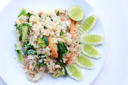 fried rice with vegetable on the white plate with withe background. Vegetarian Food, healthy food, Thai cuisineの写真素材
