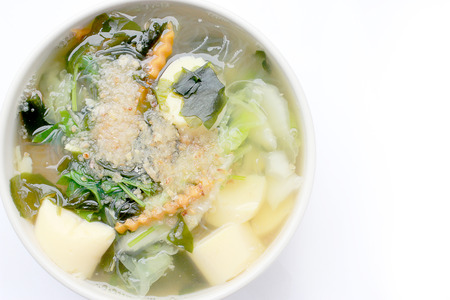 Thai style Seaweed soup with Bean Curd , mixed vegetable, Tofu  in white bowl on white background. Vegetarian Food, Healthy food, Thai foodの写真素材