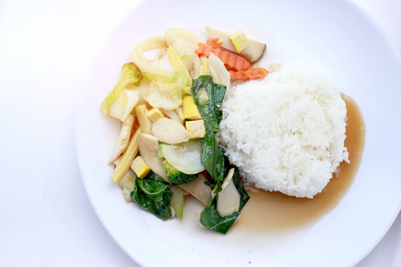 Stir Fried Tofu in Chinese Style,Deep Fried Tofu with Gravy Sauce ,Stir fried tofu with mixed vegetables in white plate on white background. Vegetarian Food, healthy food.の写真素材