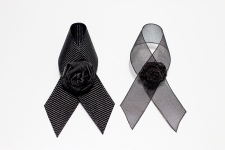 Black ribbon; decoration black ribbon hand made artistic design for sadness expression isolated on white background.の写真素材