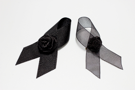 Black ribbon; decoration black ribbon hand made artistic design for sadness expression isolated on white background.の写真素材