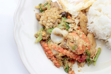 Stir-fried Soft-shelled seafood in curry powder & Thai jasmine riceの写真素材