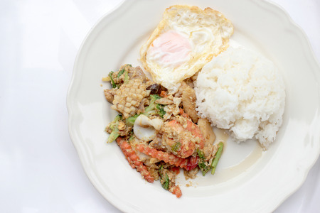 Stir-fried Soft-shelled seafood in curry powder & Thai jasmine riceの写真素材