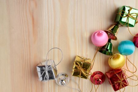 Christmas gift boxes on pine wooden table. Topview with copy space for your textの写真素材