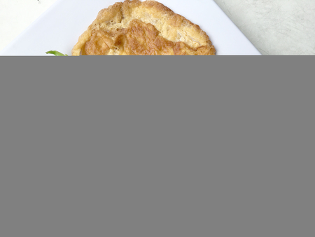 Fried Chinese kale With oyster sauce and spicy minced pork in white plate with rice and thai omelet. Thai style food.の写真素材