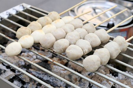 Grilled meatballs on the stove. Thai Street Food .の写真素材