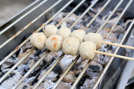 Grilled meatballs on the stove. Thai Street Food .の写真素材