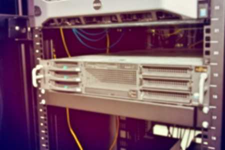 blurred image of severs computer in a rack at the large data center.の写真素材