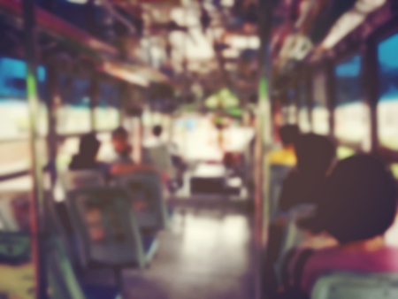 Abstract blurred image background of people on the bus at the morning in Thailand. vintage and film tone effect.の写真素材