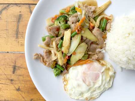 wok fried chicken stir fry chinese vegetables, corn, carrot, broccoli,の写真素材