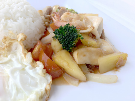 Colorful Fried Stir Sweet and sour sauce with Vegetable, shrimp and pork, a combination of fruits and vegetables in white dish on white background. Thai style food.の写真素材