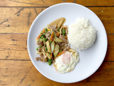wok fried chicken stir fry chinese vegetables, corn, carrot, broccoli,の写真素材