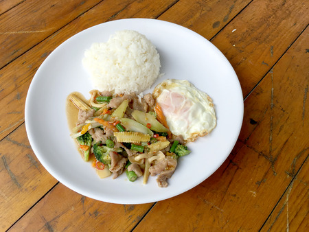 wok fried chicken stir fry chinese vegetables, corn, carrot, broccoli,の写真素材
