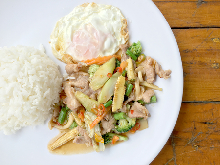 wok fried chicken stir fry chinese vegetables, corn, carrot, broccoli,の写真素材