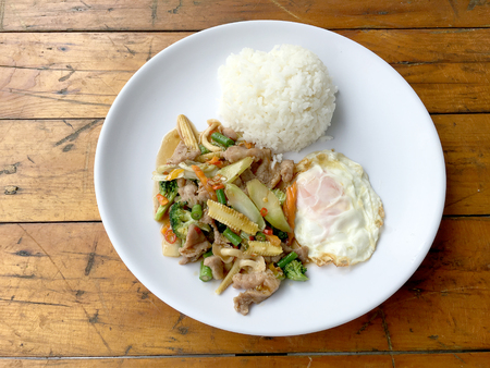 wok fried chicken stir fry chinese vegetables, corn, carrot, broccoli,の写真素材