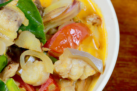 Spicy Tom Yum Soup in white blow with herb, a spicy clear soup typical in Thailand and No.1 Thai Dish Cuisine, hot and sour soup. Popular Thai Cuisine, Traditional food cuisine in Thailand,の写真素材