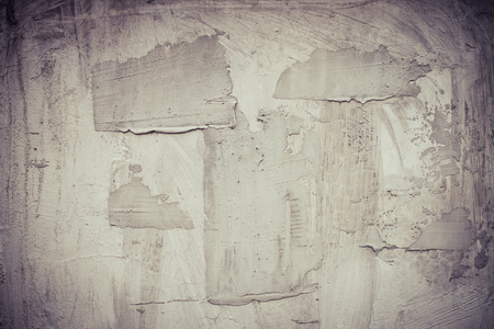 old grungy texture, wet grey concrete wall. Raw plaster wall background. Asphalt close-up. vintage tone filterの写真素材