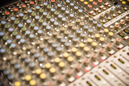 Close up of  digital sound audio mixer and amplifier equipment or music mixer equalizer console. Sound technician audio mixer equalizer control for background. studio music recording conceptの写真素材