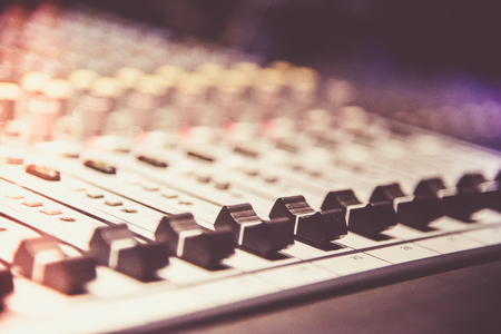 Close up of  digital sound audio mixer and amplifier equipment or music mixer equalizer console. Sound technician audio mixer equalizer control for background. studio music recording conceptの写真素材