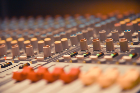 Close up of  digital sound audio mixer and amplifier equipment or music mixer equalizer console....