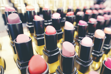 Colourful Lipstick in store or shopping Malls. Lipstick tints palette, Professional Makeup and Beauty. Beautiful Make-up concept. Lipgloss. huge assortment of women luxurious lipsticks, free shipping.の写真素材