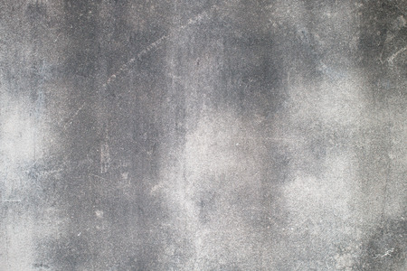 old grungy texture, wet grey concrete wall. Raw plaster wall background. Asphalt close-up. vintage tone filterの写真素材