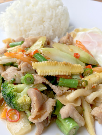 wok fried chicken stir fry chinese vegetables, corn, carrot, broccoli,の写真素材