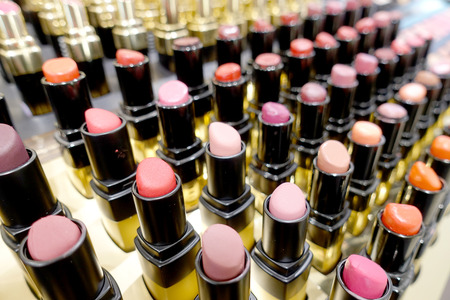 Colourful Lipstick in store or shopping Malls. Lipstick tints palette, Professional Makeup and Beauty. Beautiful Make-up concept. Lipgloss. huge assortment of women luxurious lipsticks, free shipping.の写真素材