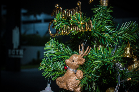 Closeup of Christmas decorations, gifts on Christmas tree, gifts, for new year background. vintage tone with copy space.の写真素材