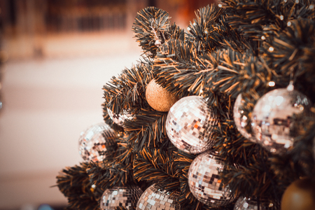 blurred image of Christmas Decorations In Christmas Tree with copy space of blur light boken and people background. vintage toneの写真素材