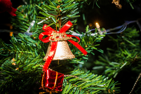 Closeup of Christmas decorations, gifts on Christmas tree, gifts, for new year background. vintage tone with copy space.の写真素材