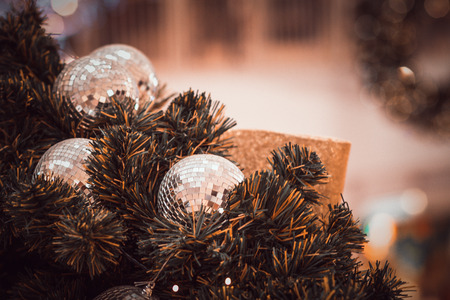 blurred image of Christmas Decorations In Christmas Tree with copy space of blur light boken and people background. vintage toneの写真素材