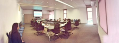 Blurred image of business people and student sitting in conference room, meeting room for profession seminar with screen projector for present information. education or training concept. panorama viewの写真素材
