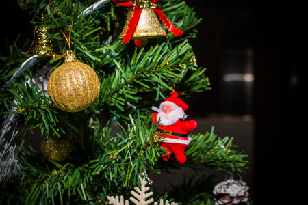 Closeup of Christmas decorations, gifts on Christmas tree, gifts, for new year background. vintage tone with copy space.の写真素材