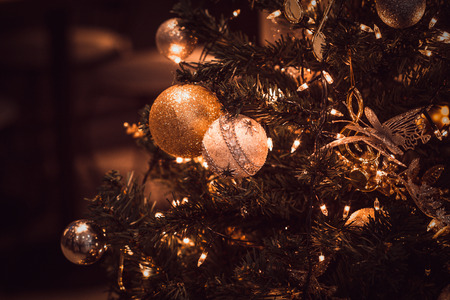 blurred image of Christmas Decorations In Christmas Tree with copy space of blur light boken and people background. vintage toneの写真素材
