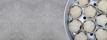 Kind of Chinese sweetmeat steamed in a basket in tray or Chinese new year, coconut and pandan rice cakes. chinese dessert is a food prepared from glutinous rice and consumed.の写真素材