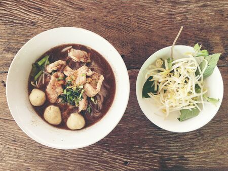 Thai beef noodles braised taste delicious in Thai style on stainless steel table. Very delicious local food with many kinds of ingredients in  thailand, Thai style food.Top view & flat layの写真素材