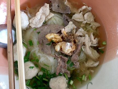 Thai beef noodles braised taste delicious in Thai style on stainless steel table. Very delicious local food with many kinds of ingredients in  thailand, Thai style food.の写真素材