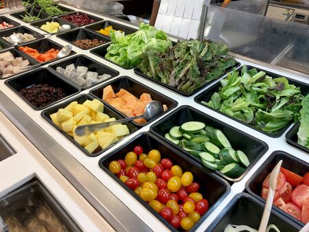 Fresh salad bar with various fresh assortment of ingredients, fruits and proteins Variety of vegetable set for display space of the options for the choice of clients in the supermarket. Take yourselfの写真素材