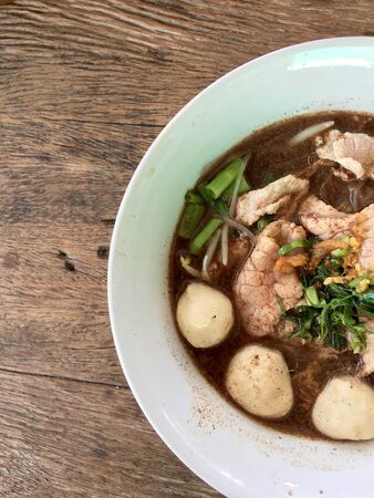 Thai beef noodles braised taste delicious in Thai style on stainless steel table. Very delicious local food with many kinds of ingredients in  thailand, Thai style food.Top view & flat layの写真素材