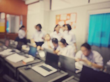 Education concept, Blurred image of the student learning technology and workshop using computer together in computer room in secondary, university for study, Network communication and trainingの写真素材